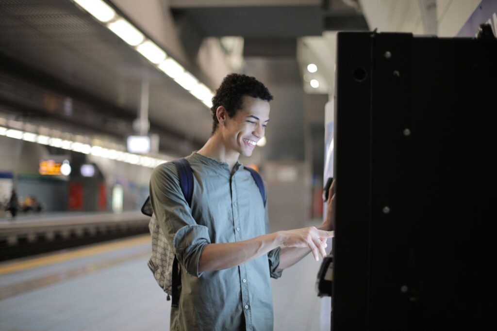 man using a vending machine to conveniently buy a snack