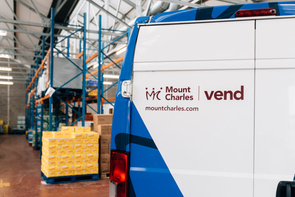 A close up of Mount Charles vending branding on a corporate van in the warehouse