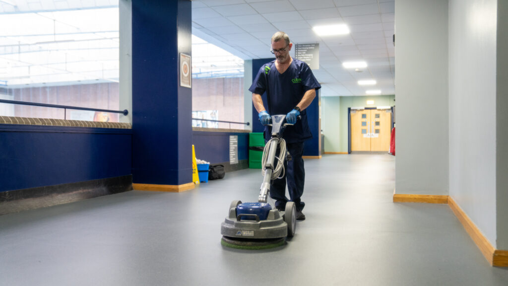 Mount Charles cleaning contracts team member cleaning floor of commercial premises