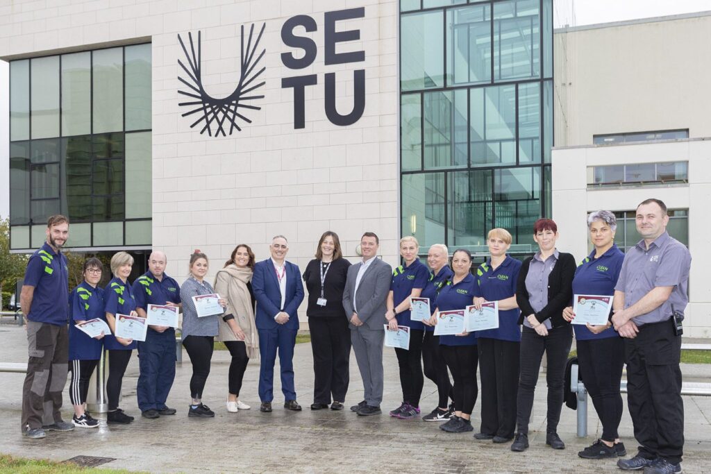 SETU cleaning team posing outside the building