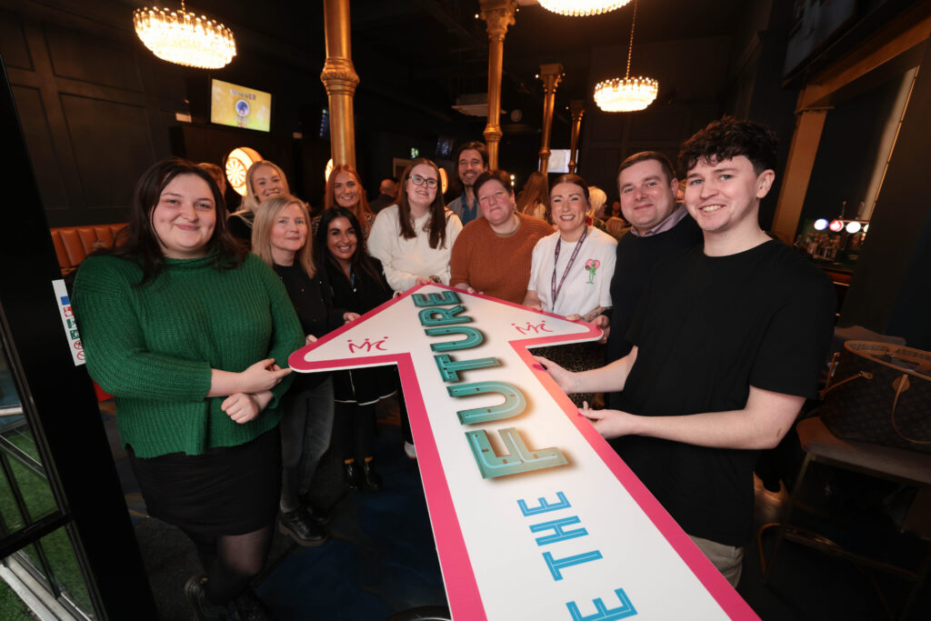 Various members of Mount Charles team holding You are the Future arrow at Strategy Launch Day 2025