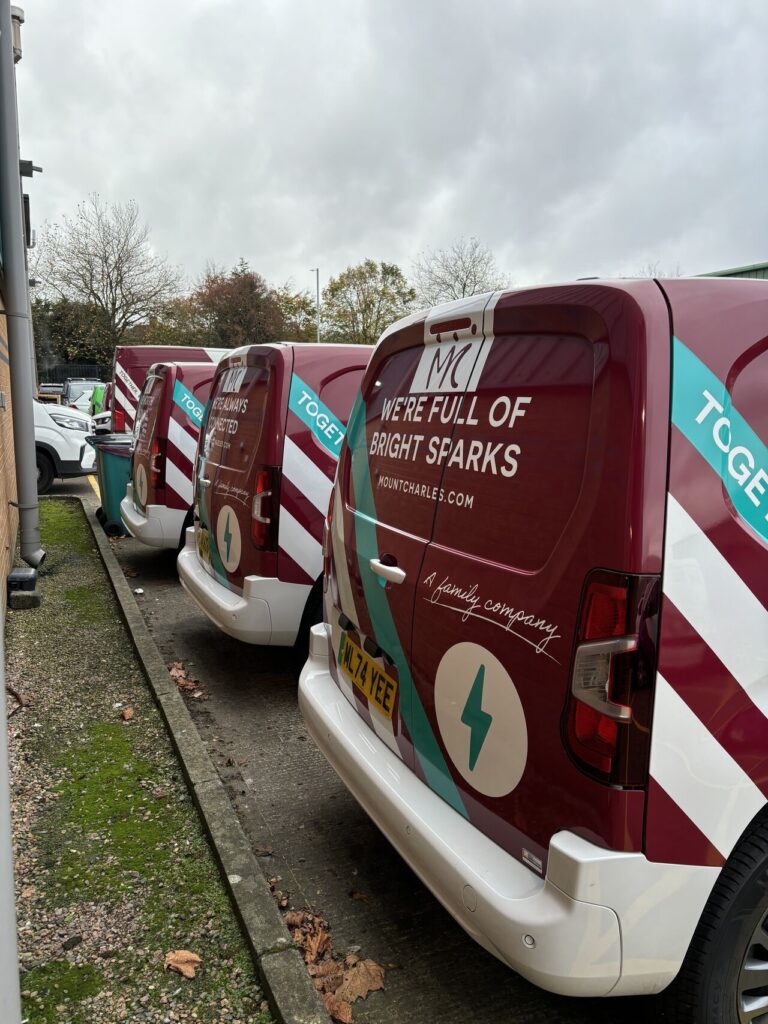 A line of Mount Charles branded electric vans
